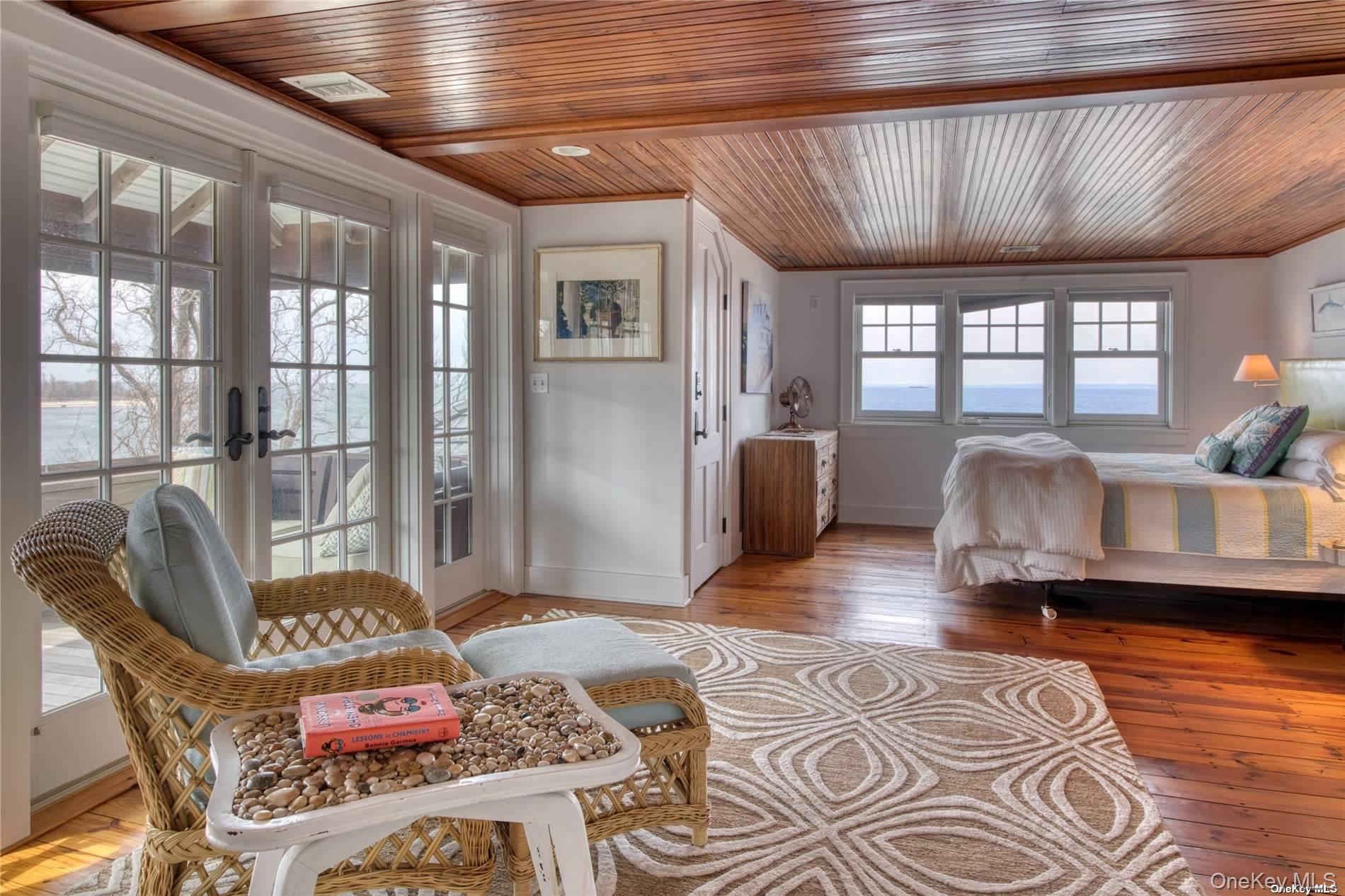 2100 Youngs Road Orient, NY 11957 - Photo 10 of 22 a living room with furniture and wooden floor