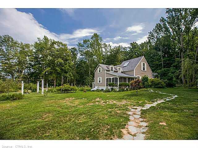 97 Pinewood Road Guilford, CT 06437 - Photo 1 of 1 a front view of a house with a yard