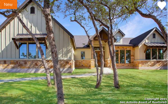 a house that has a tree in front of it