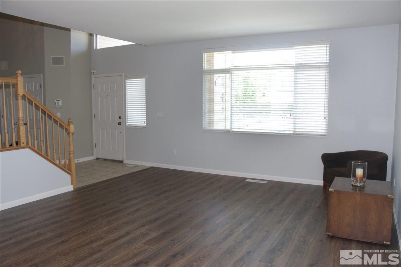 402 Solitude Court Reno, NV 89511 - Photo 3 of 17 a view of room with window and wooden floor