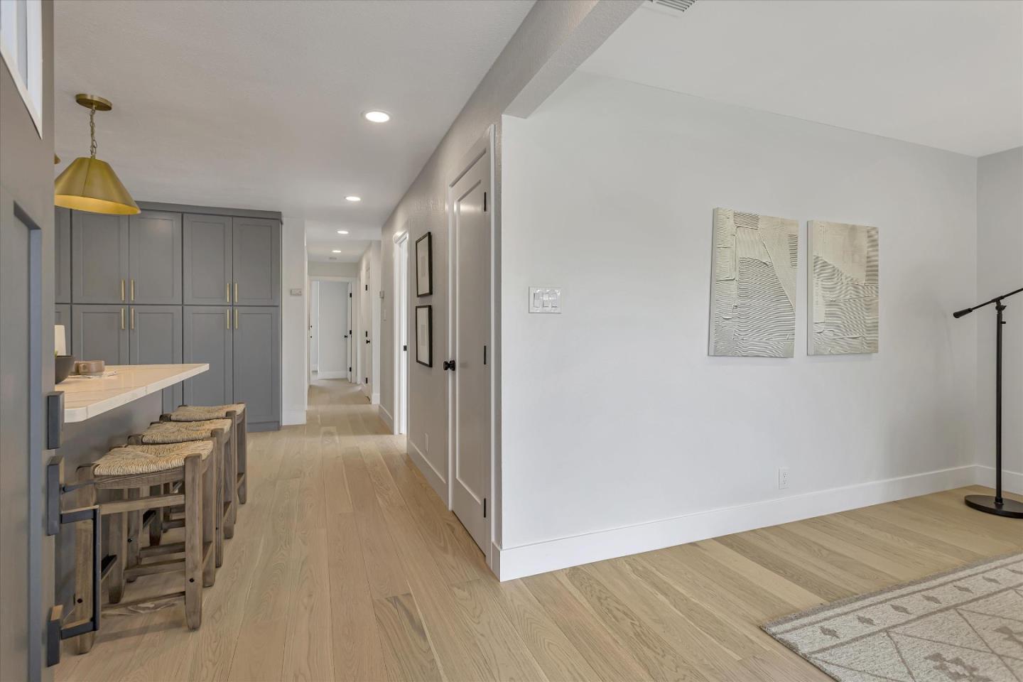 2860 Encinitas Court San Jose, CA 95132 - Photo 12 of 45 a view of a hallway with wooden floor and a chandelier