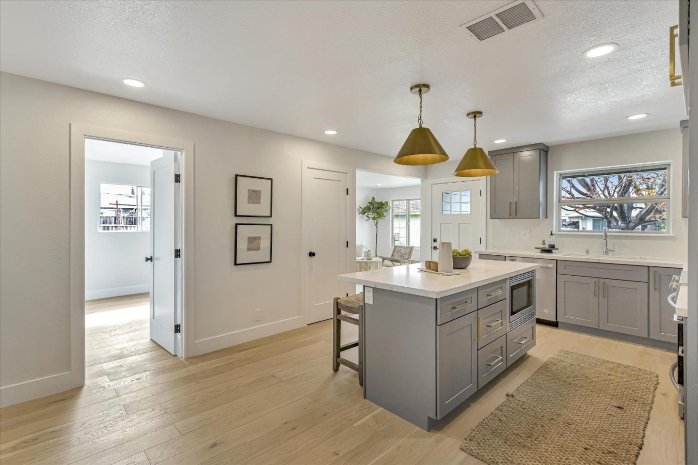 2860 Encinitas Court San Jose, CA 95132 - Photo 15 of 45 a kitchen with a stove and a clock