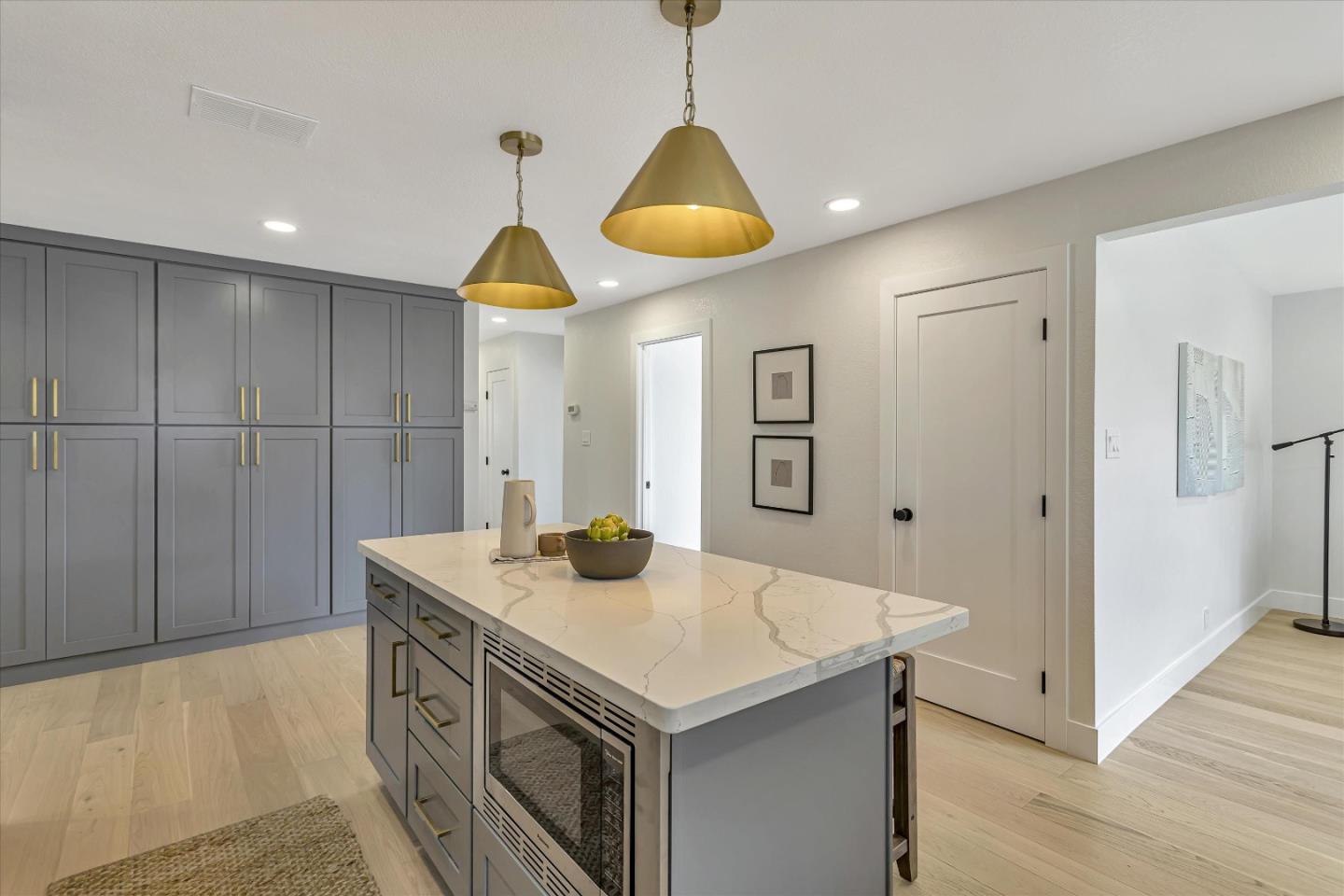 2860 Encinitas Court San Jose, CA 95132 - Photo 16 of 45 a kitchen with a sink cabinets and wooden floor