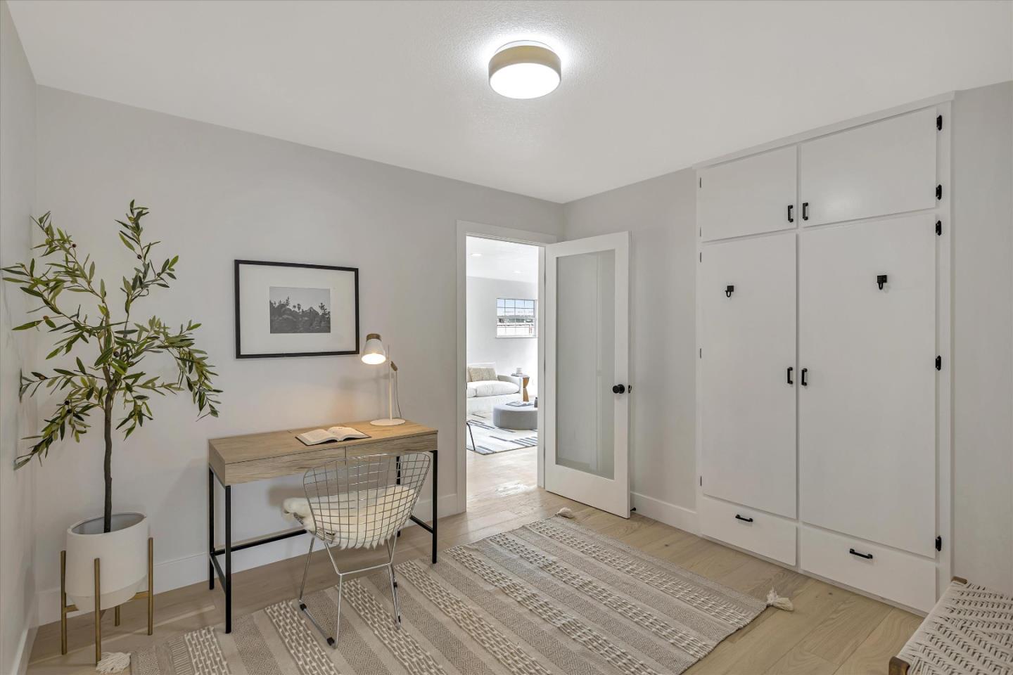 2860 Encinitas Court San Jose, CA 95132 - Photo 21 of 45 a workspace with wooden floor and a potted plant
