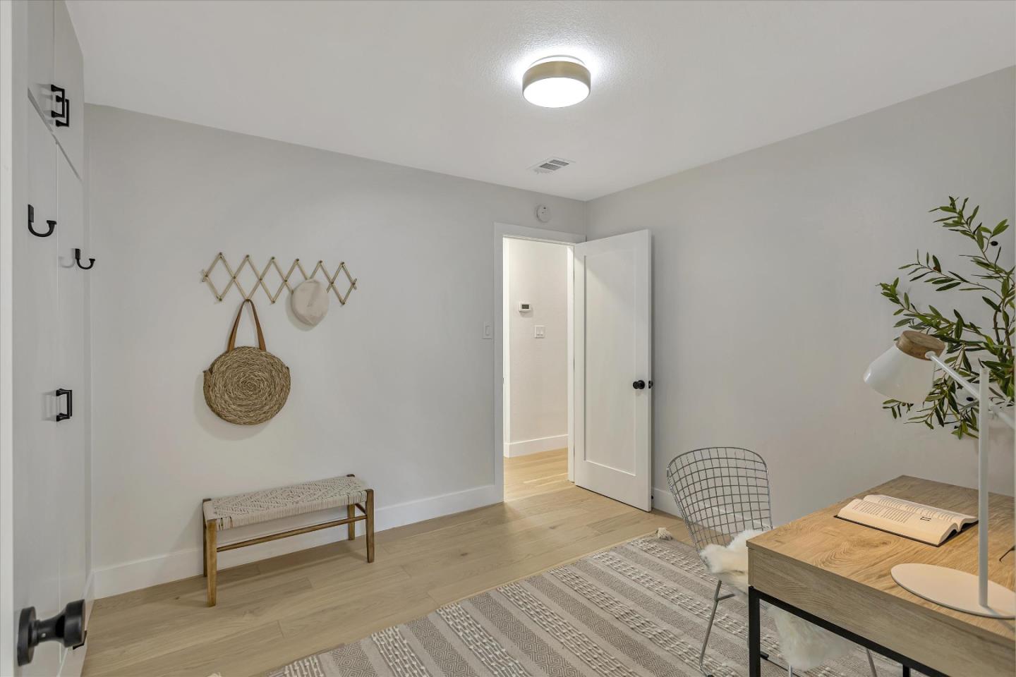 2860 Encinitas Court San Jose, CA 95132 - Photo 22 of 45 a view of a room with wooden floor and furniture