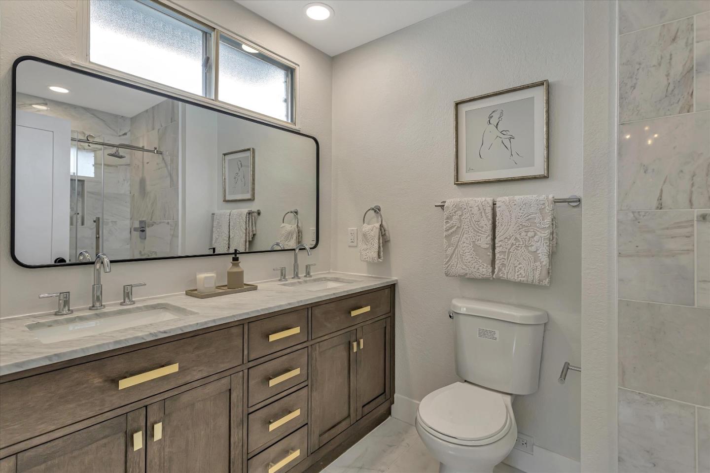 2860 Encinitas Court San Jose, CA 95132 - Photo 32 of 45 a bathroom with a granite countertop toilet sink and mirror