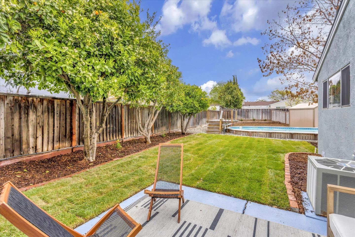2860 Encinitas Court San Jose, CA 95132 - Photo 34 of 45 a view of a swimming pool with a patio and a yard