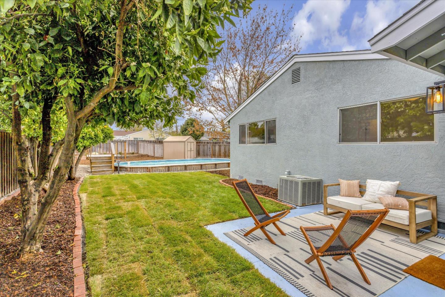 2860 Encinitas Court San Jose, CA 95132 - Photo 36 of 45 a view of a patio with table and chairs and potted plants