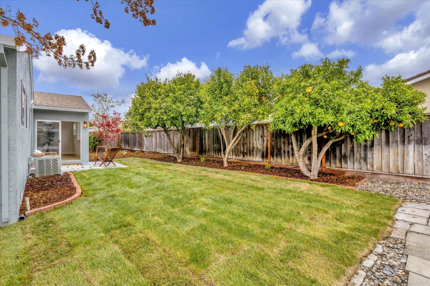 2860 Encinitas Court San Jose, CA 95132 - Photo 37 of 45 a backyard of a house with table and chairs