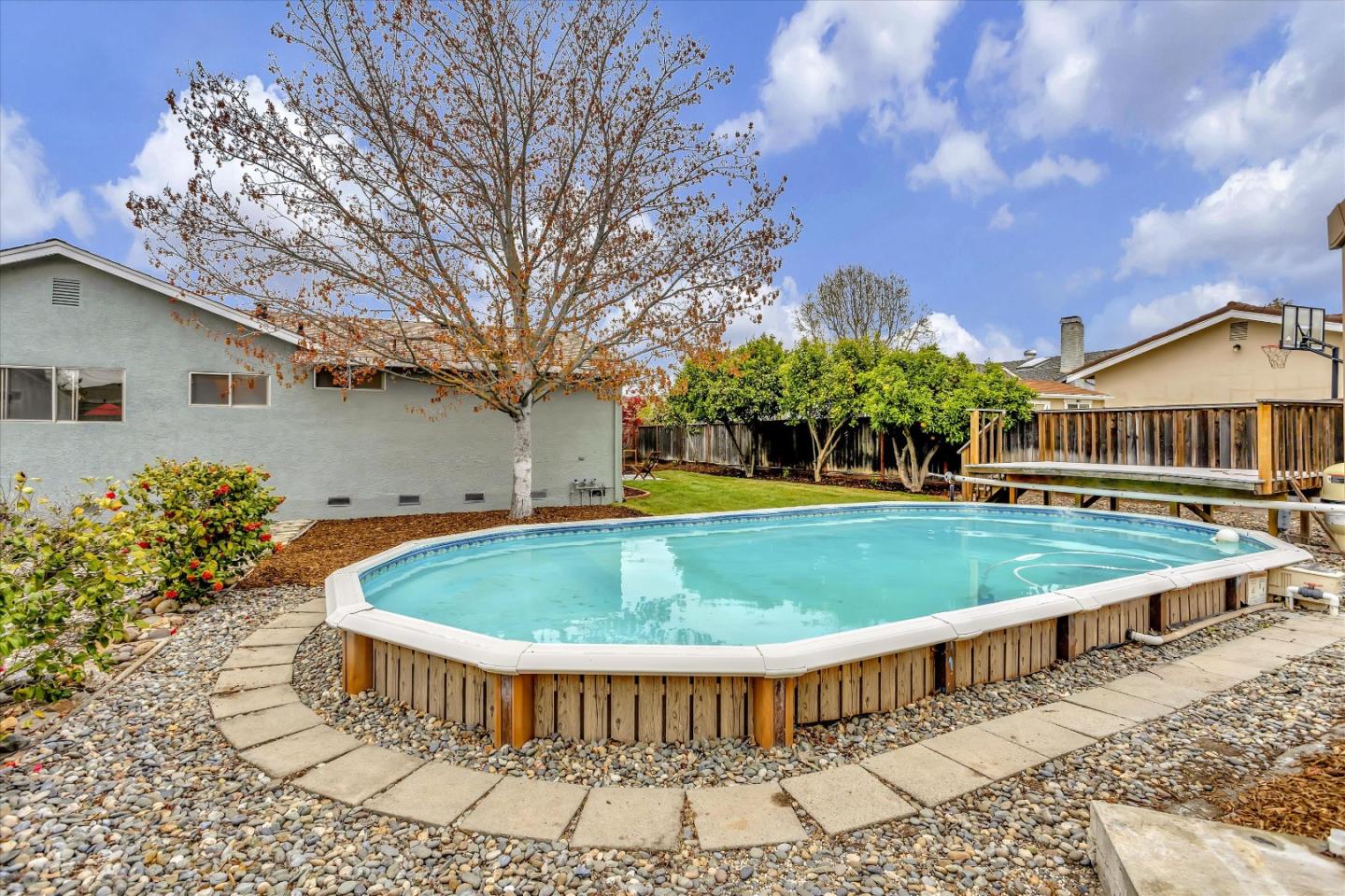 2860 Encinitas Court San Jose, CA 95132 - Photo 43 of 45 a view of a house with a swimming pool and a yard