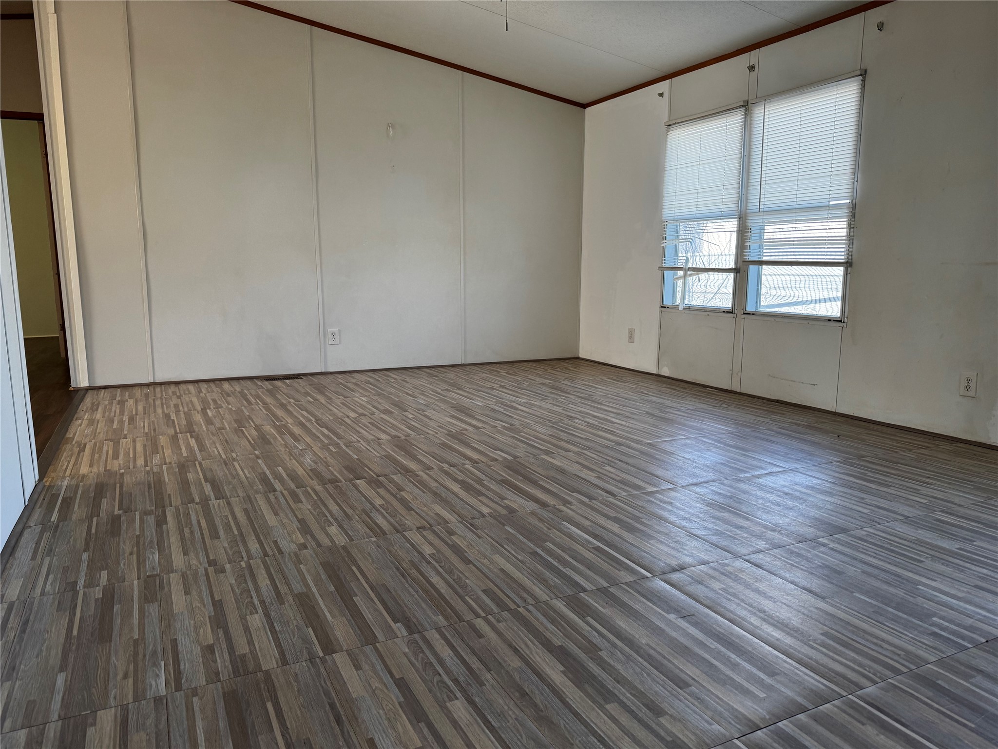15930 Boss Gaston Road Sugar Land, TX 77498 - Photo 18 of 20 a view of an empty room with wooden floor and a window