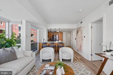 a living room with furniture and a rug