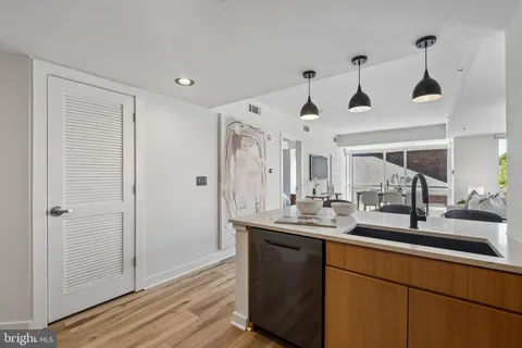 a bathroom with double vanity and a mirror