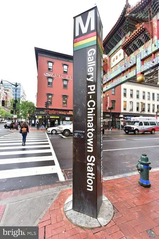 a sign board on the side of a street