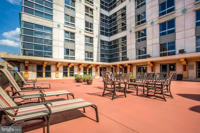a view of a patio with a table and chairs