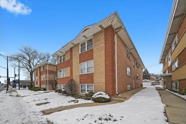 a view of a street with a building in the background