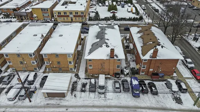 an aerial view of a residential building with an outdoor space