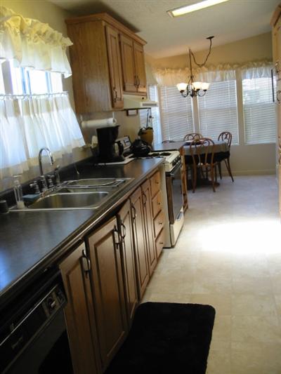 88 Yosemite Road, Unit 88 San Rafael, CA 94903 - Photo 7 of 11 a kitchen with sink cabinets and window
