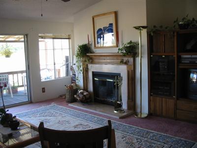 88 Yosemite Road, Unit 88 San Rafael, CA 94903 - Photo 10 of 11 a living room with furniture and a fireplace