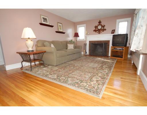 36 Valentine Road Arlington, MA 02476 - Photo 8 of 29 a living room with furniture and a fireplace