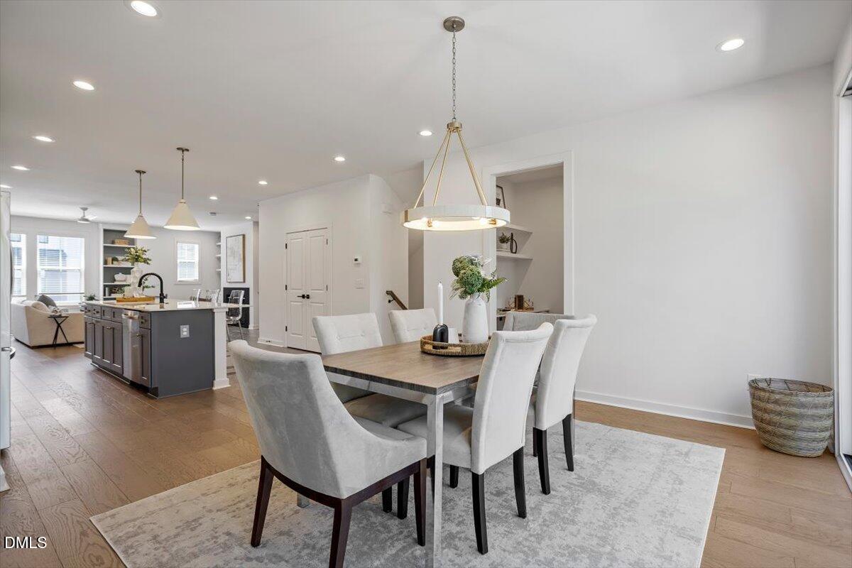 6419 Tanner Oak Lane Raleigh, NC 27613 - Photo 16 of 39 a view of a dining room with furniture