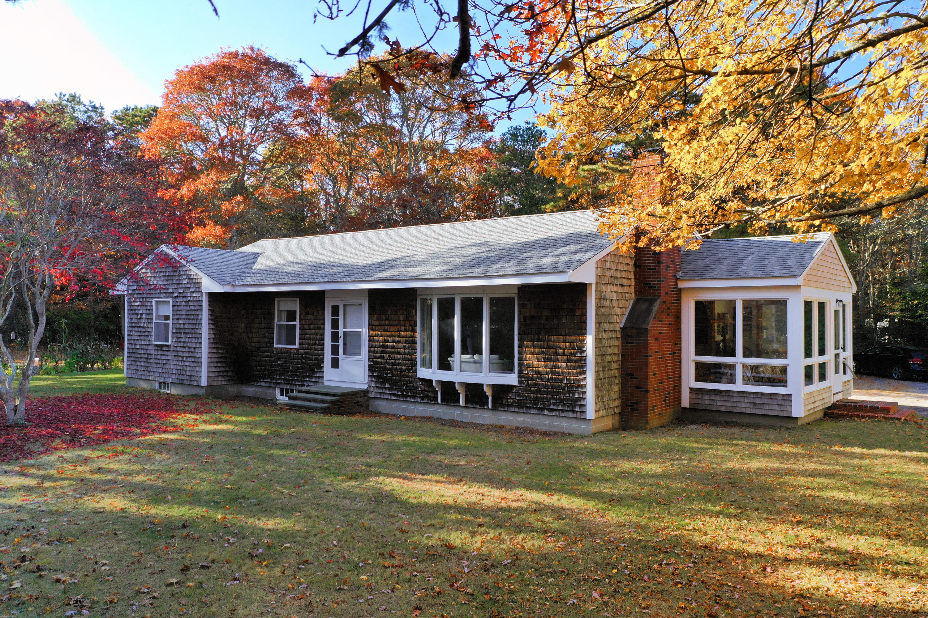 169-173 Old Post Road Centerville, MA 02632 - Photo 11 of 50 a view of a house with a swimming pool with a yard