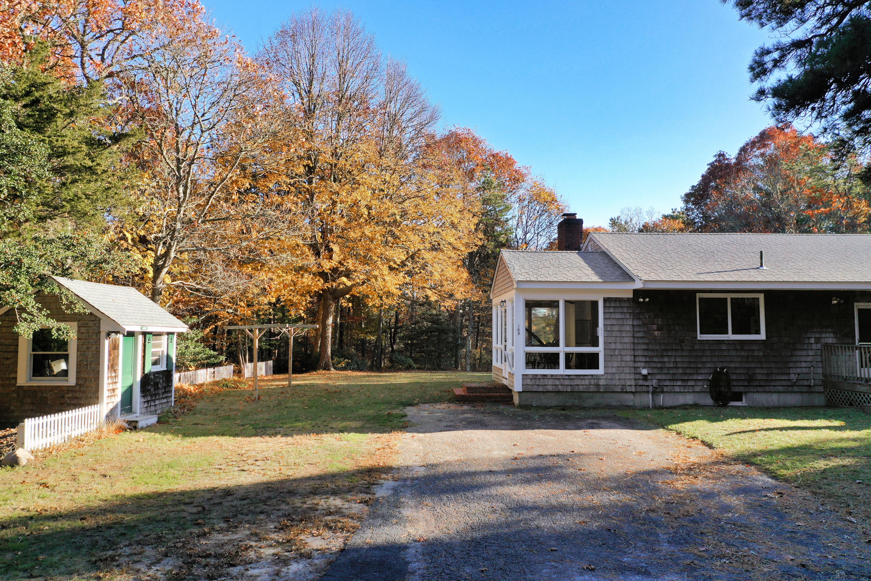 169-173 Old Post Road Centerville, MA 02632 - Photo 14 of 50 a front view of a house with a yard