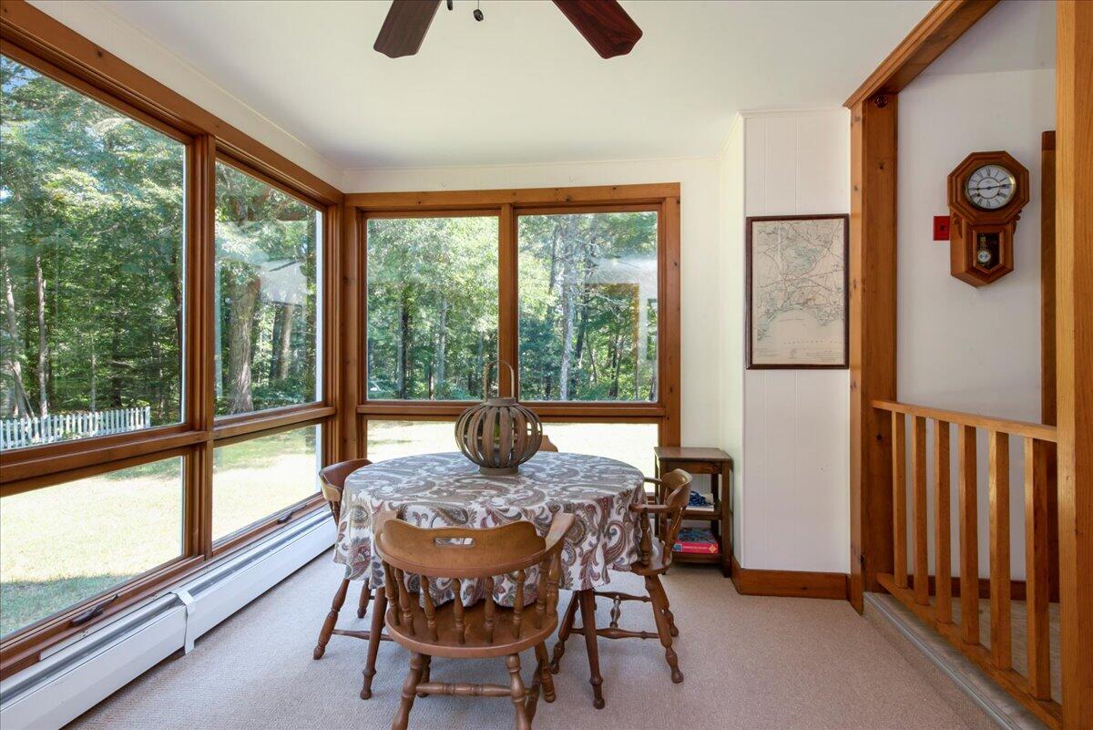 169-173 Old Post Road Centerville, MA 02632 - Photo 19 of 50 a dining room with furniture water view and a floor to ceiling window