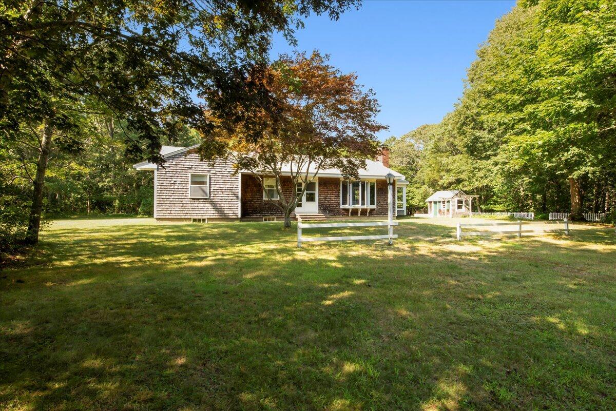 169-173 Old Post Road Centerville, MA 02632 - Photo 2 of 50 a house view with swimming pool in front of it