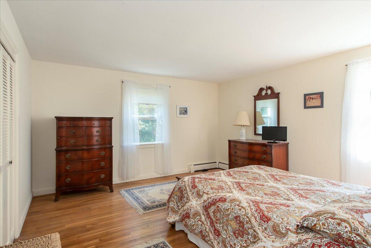 169-173 Old Post Road Centerville, MA 02632 - Photo 34 of 50 a bedroom with a bed and a dresser