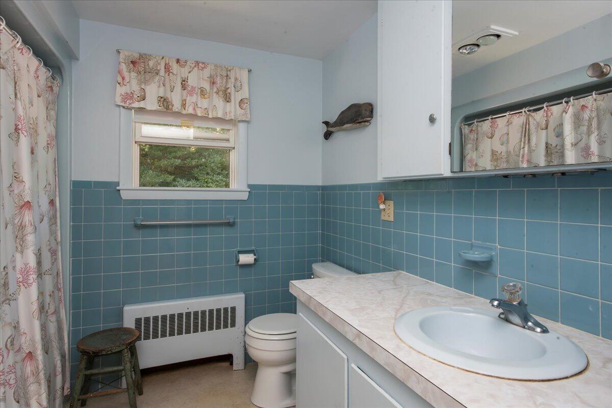 169-173 Old Post Road Centerville, MA 02632 - Photo 36 of 50 a bathroom with a sink and a toilet