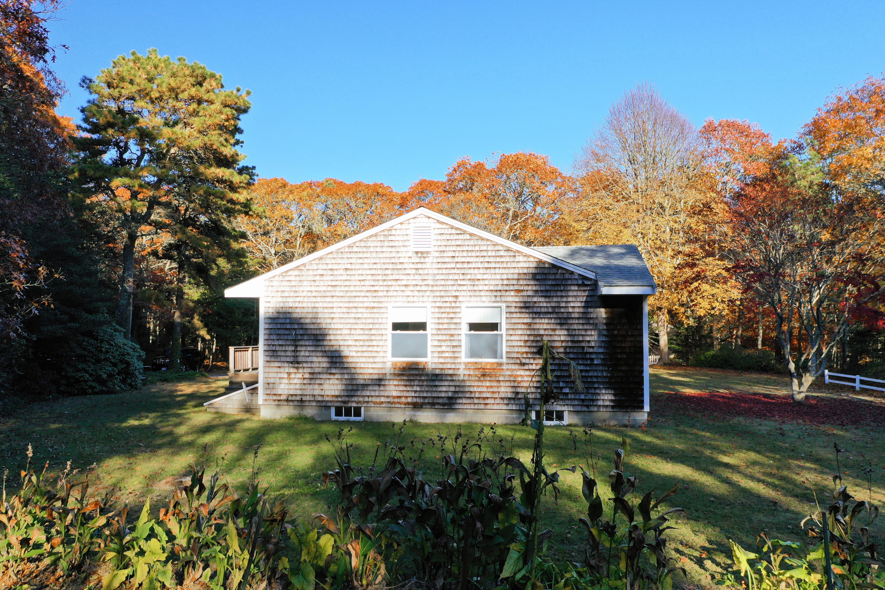169-173 Old Post Road Centerville, MA 02632 - Photo 9 of 50 a view of a house with a yard