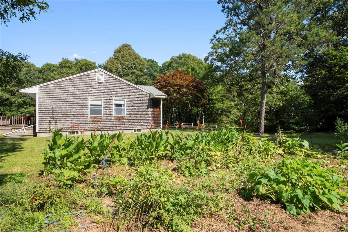 169-173 Old Post Road Centerville, MA 02632 - Photo 10 of 50 a view of a house with a yard and plants