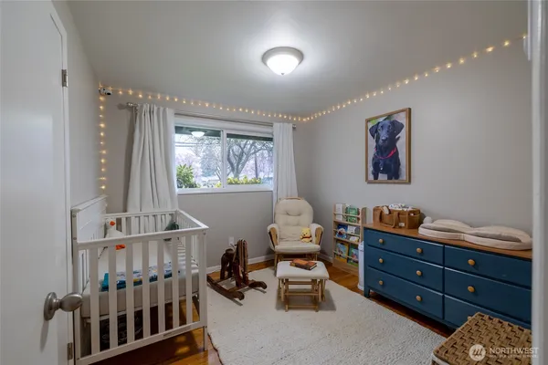 a bedroom with furniture and a window