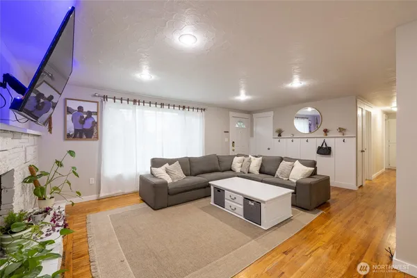 a living room with furniture and a potted plant