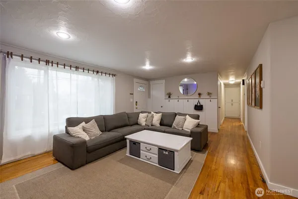 a living room with furniture and a rug