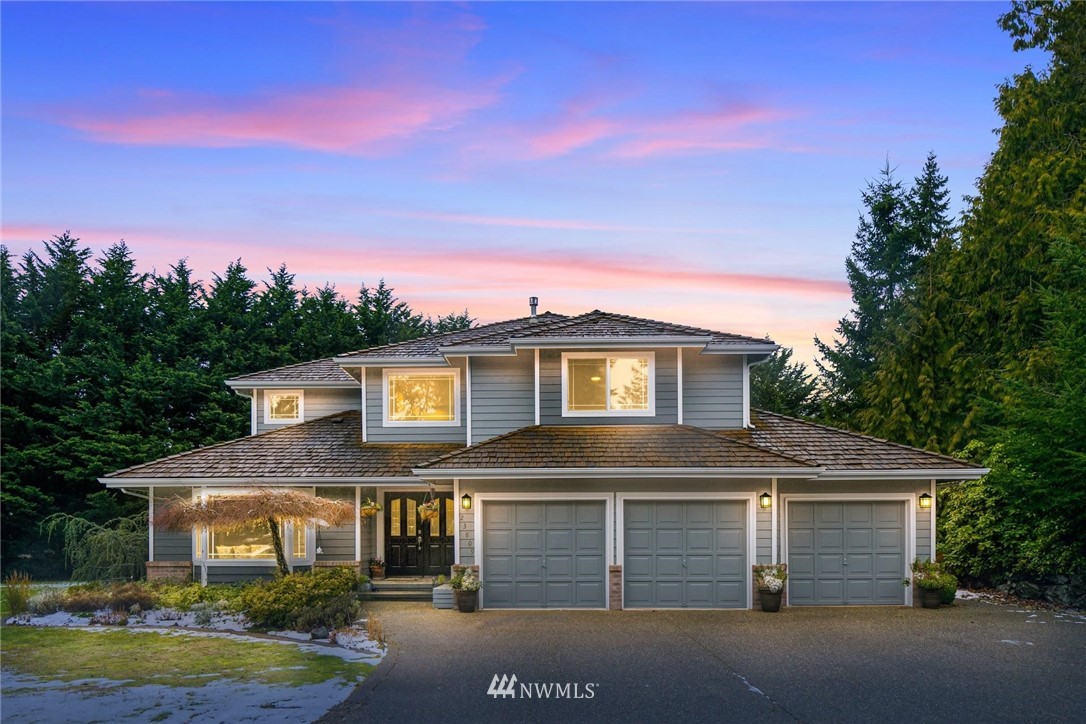 23809 Southeast 243rd Street Maple Valley, WA 98038 - Photo 1 of 40 a front view of a house with a garden and yard