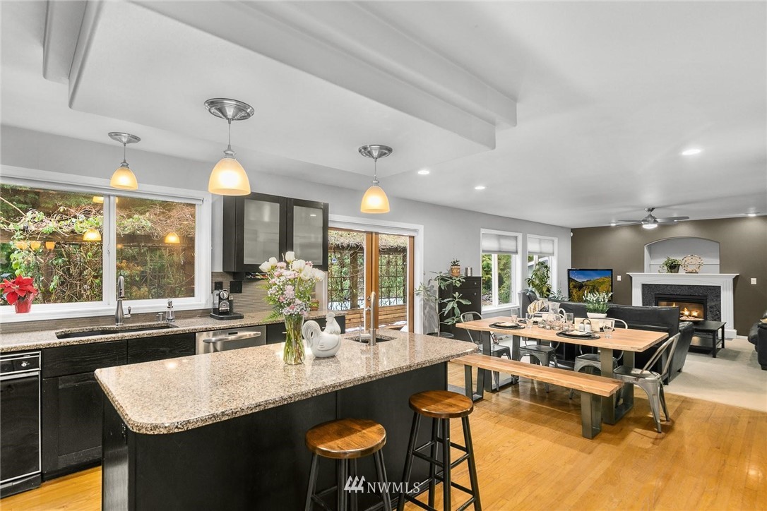 23809 Southeast 243rd Street Maple Valley, WA 98038 - Photo 12 of 40 a kitchen with counter space dining table and chairs