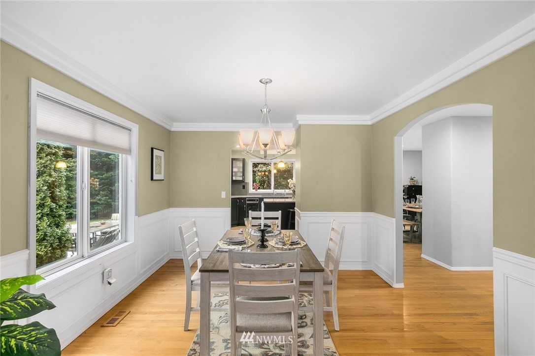 23809 Southeast 243rd Street Maple Valley, WA 98038 - Photo 13 of 40 a view of a dining room with furniture window and wooden floor