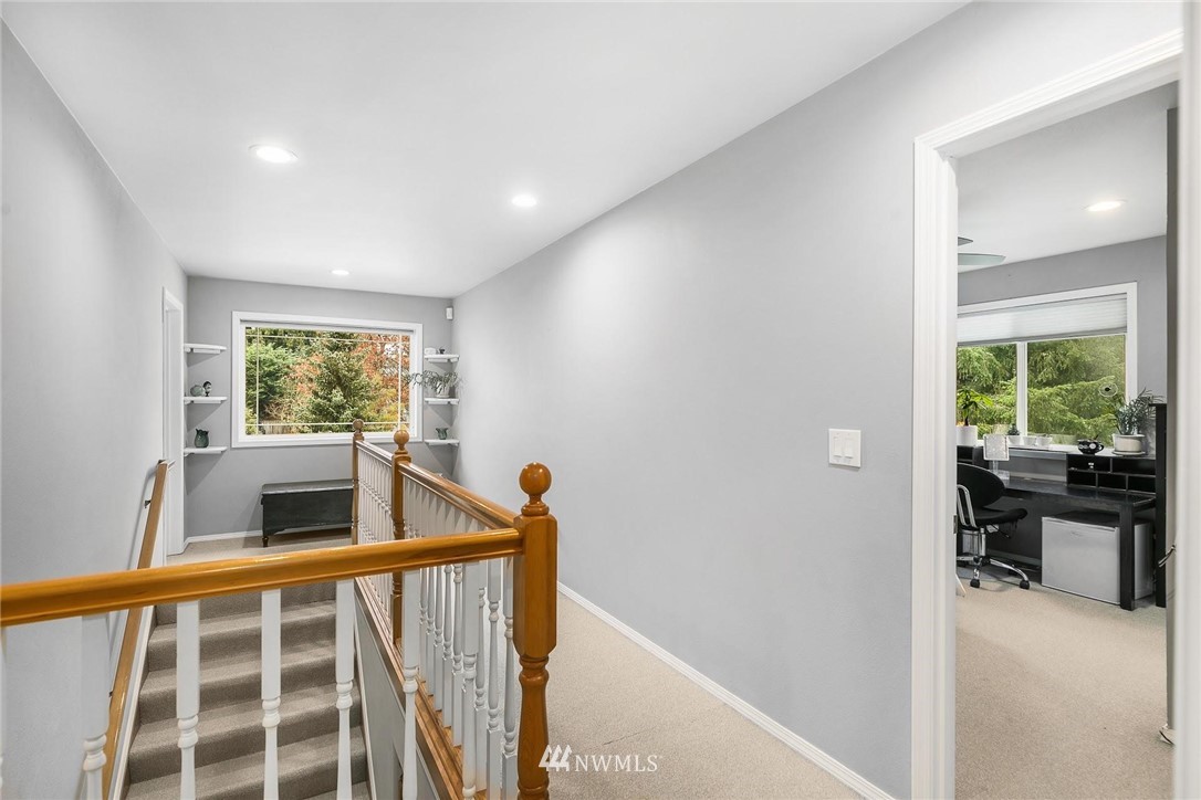 23809 Southeast 243rd Street Maple Valley, WA 98038 - Photo 16 of 40 a view of kitchen with wooden floor and windows