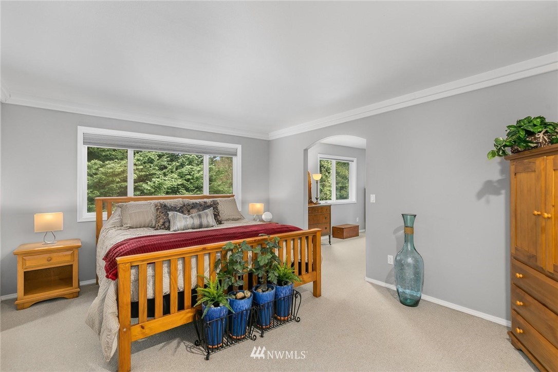 23809 Southeast 243rd Street Maple Valley, WA 98038 - Photo 17 of 40 a bed room with furniture and a window