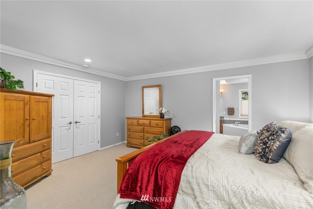 23809 Southeast 243rd Street Maple Valley, WA 98038 - Photo 18 of 40 a bedroom with a bed and a closet