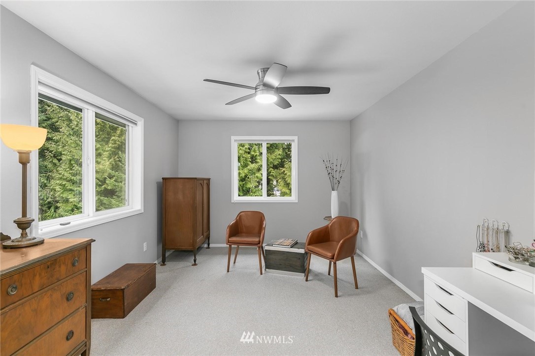 23809 Southeast 243rd Street Maple Valley, WA 98038 - Photo 19 of 40 a living room with furniture and a window