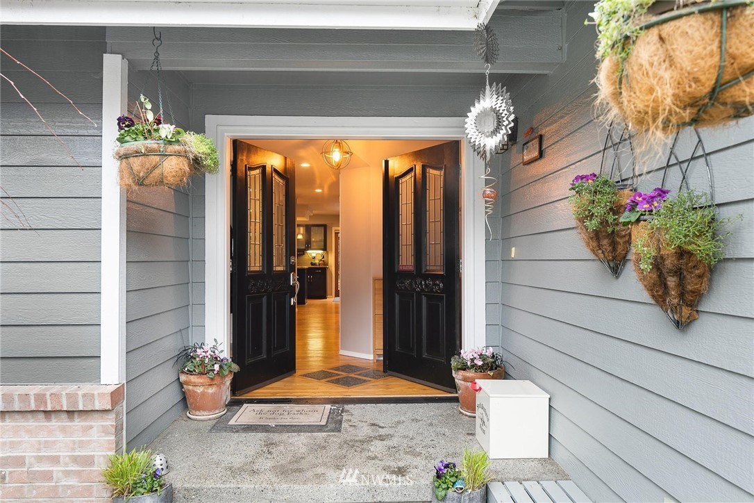 23809 Southeast 243rd Street Maple Valley, WA 98038 - Photo 3 of 40 a potted plant sitting in front of a door