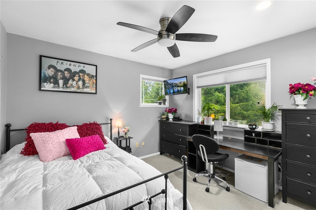 23809 Southeast 243rd Street Maple Valley, WA 98038 - Photo 25 of 40 a bedroom with a bed and a desk
