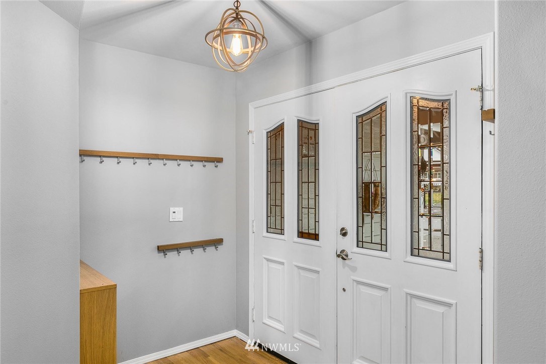 23809 Southeast 243rd Street Maple Valley, WA 98038 - Photo 4 of 40 a view of a hallway with entryway