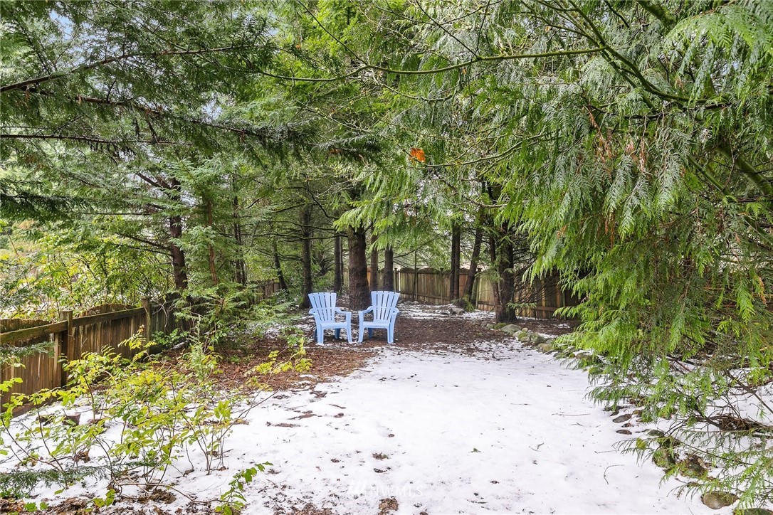 23809 Southeast 243rd Street Maple Valley, WA 98038 - Photo 32 of 40 a view of a bench in a backyard