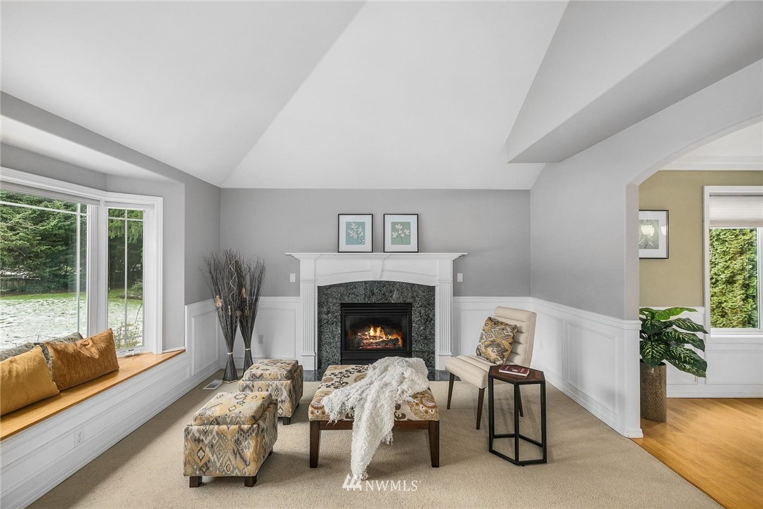 23809 Southeast 243rd Street Maple Valley, WA 98038 - Photo 5 of 40 a living room with furniture and a fireplace
