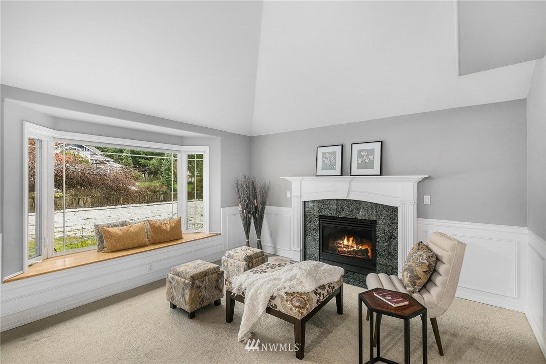 23809 Southeast 243rd Street Maple Valley, WA 98038 - Photo 6 of 40 a living room with furniture and a fireplace