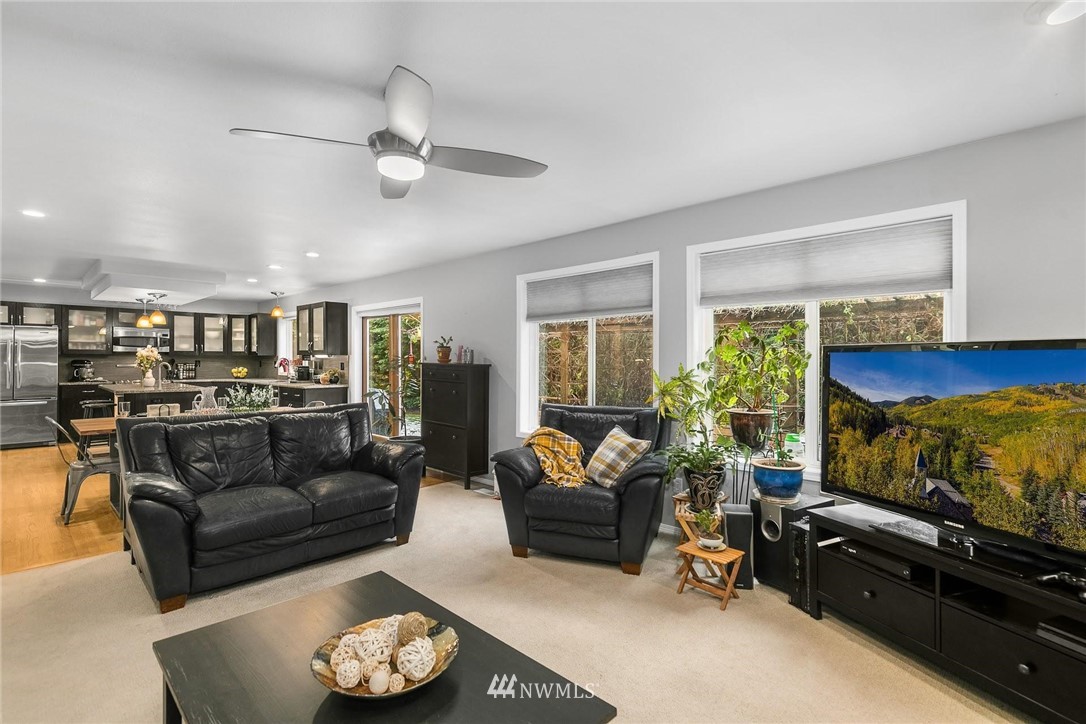 23809 Southeast 243rd Street Maple Valley, WA 98038 - Photo 8 of 40 a living room with furniture and a flat screen tv